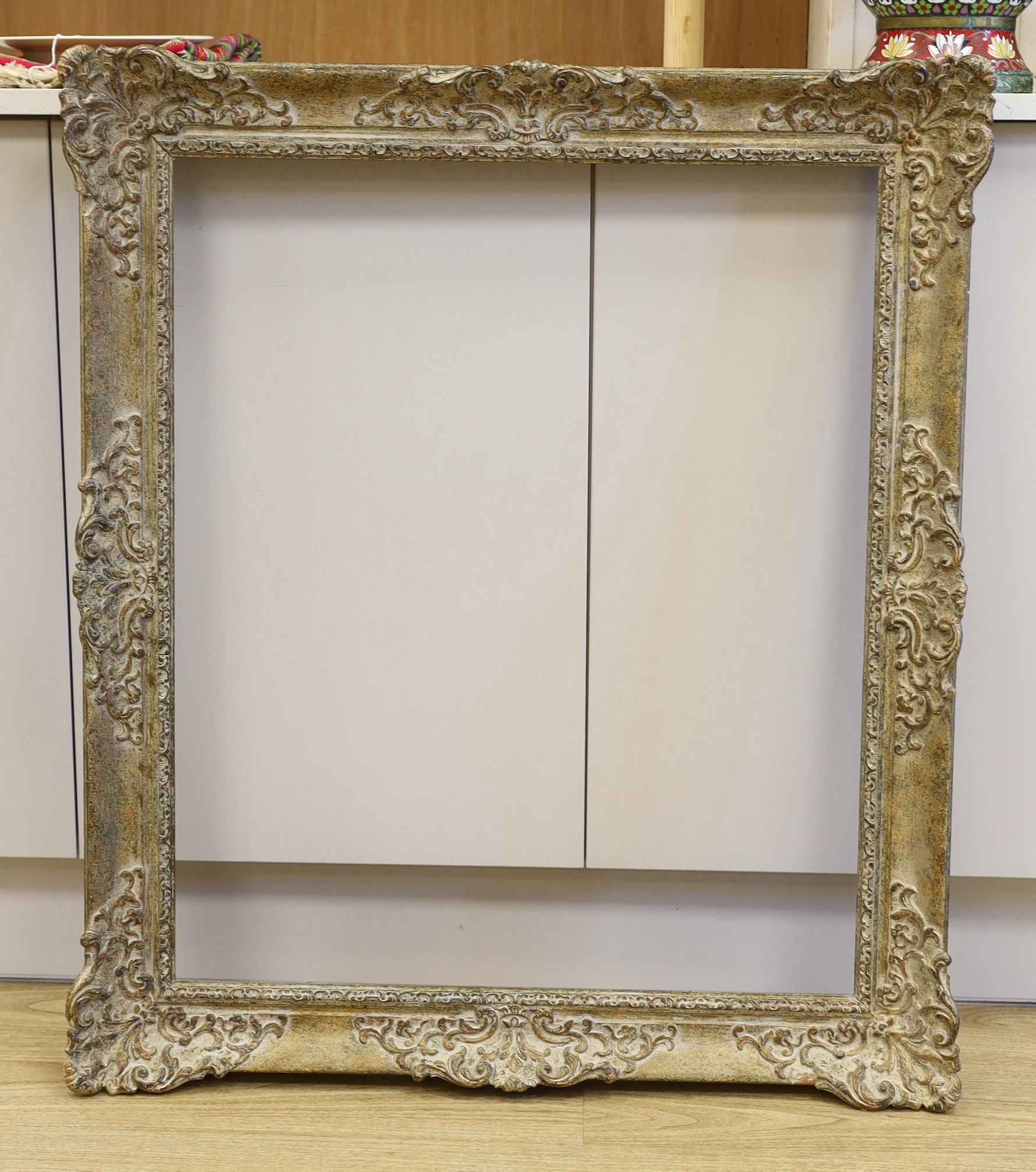 A moulded picture frame, approximately 64cm x 76cm